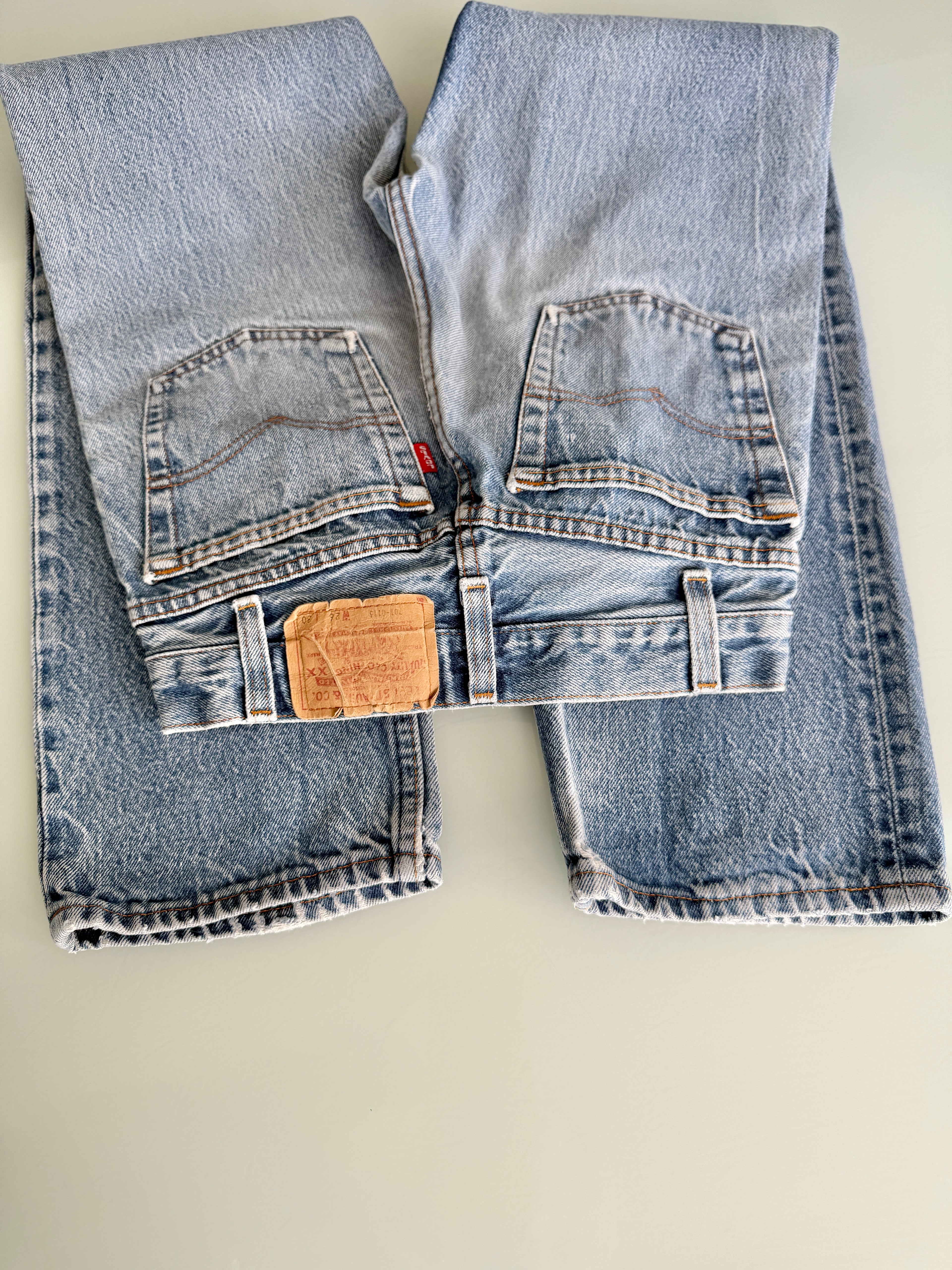 W23 L29 vintage Levis 701 22-24” measured waist faded denim made in USA 80s