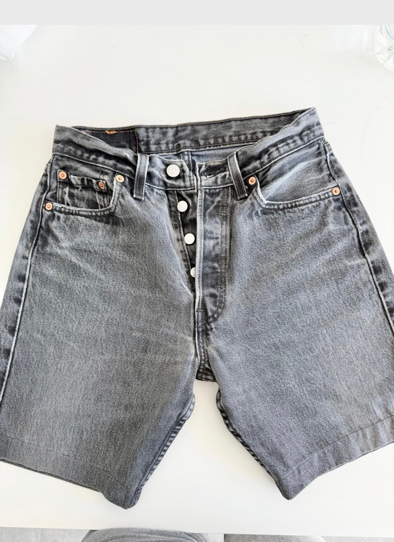 W26 Levis shorts 501 vintage 25-26” waist black faded 501s made in USA for women 90s