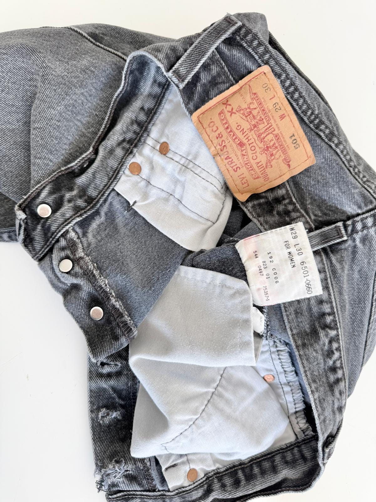 W26 Levis 501 vintage 25-26” waist black faded 501s made in USA for women 90s