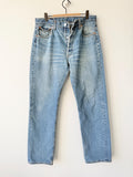 W32 L31 vintage Levis 501 31-32” measured medium faded lines blue made in Y2K