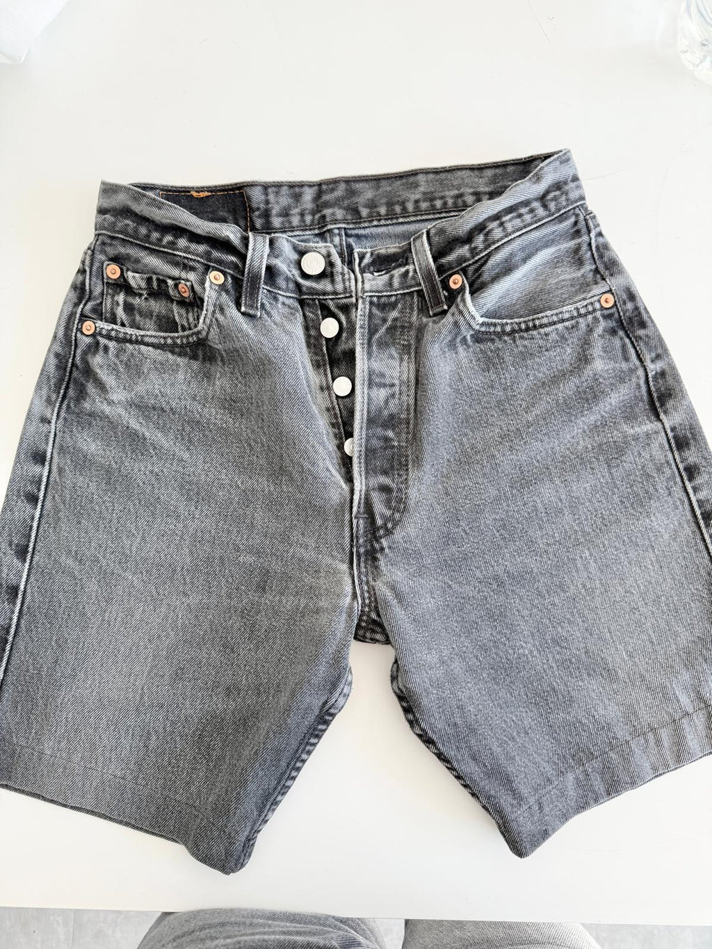 W26 Levis 501 vintage 25-26” waist black faded 501s made in USA for women 90s