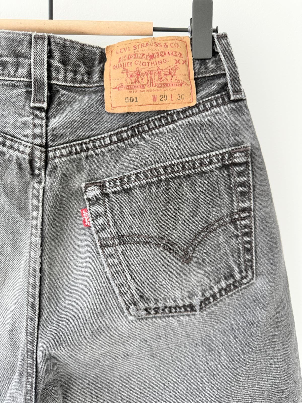 W26 Levis 501 vintage 25-26” waist black faded 501s made in USA for women 90s