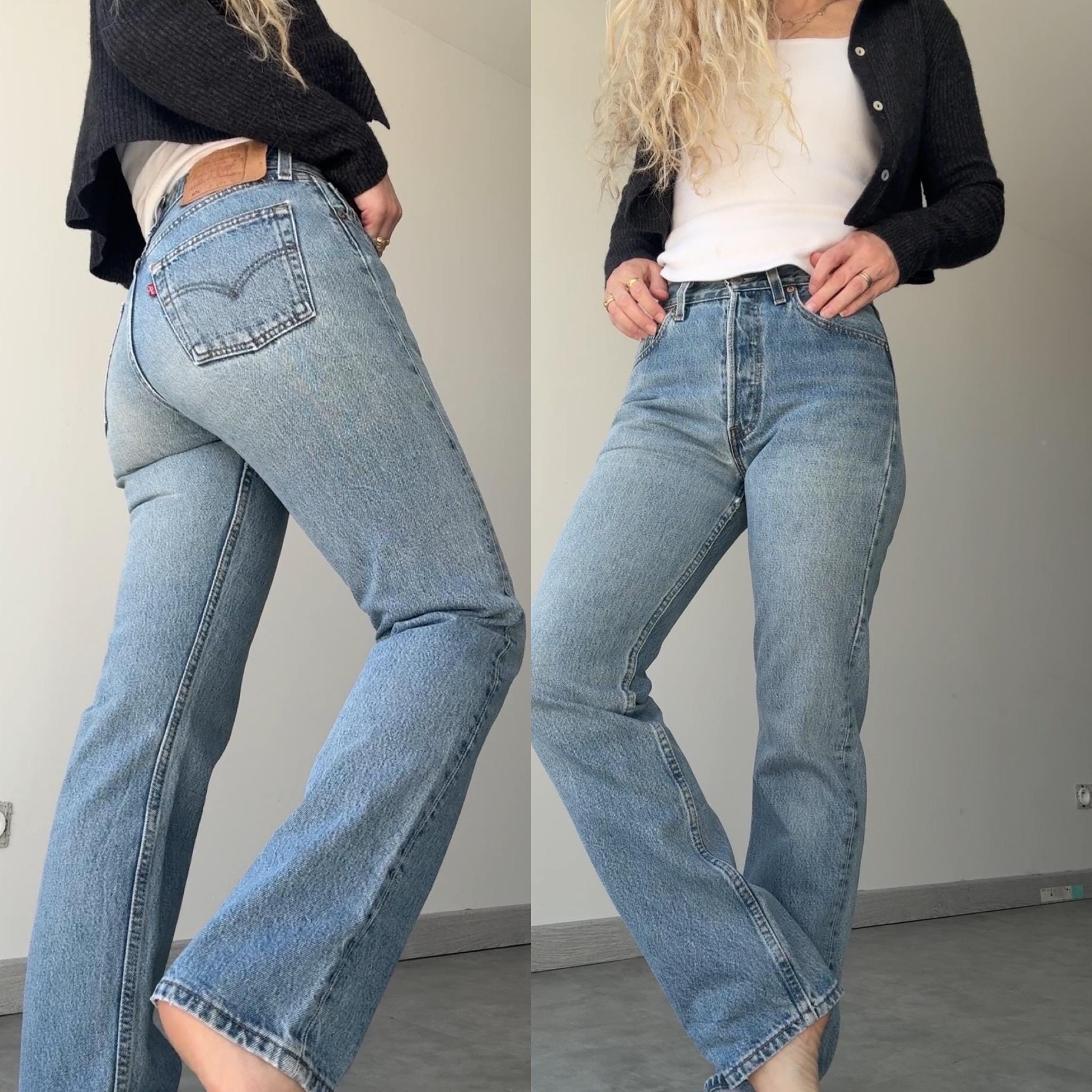 W27 L29 Levis 501 vintage 26-27” measured waist medium blue made in USA 90s for women tag