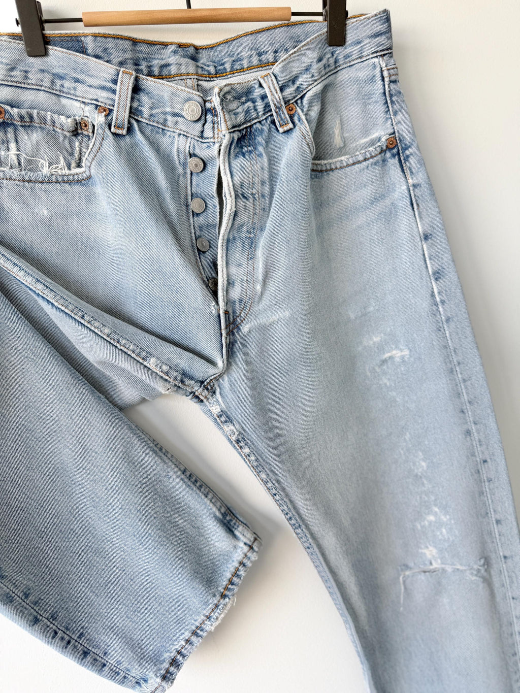 W31 L31 vintage Levis 501 30-31” measured waist light blue very distressed faded denim made in USA 90s