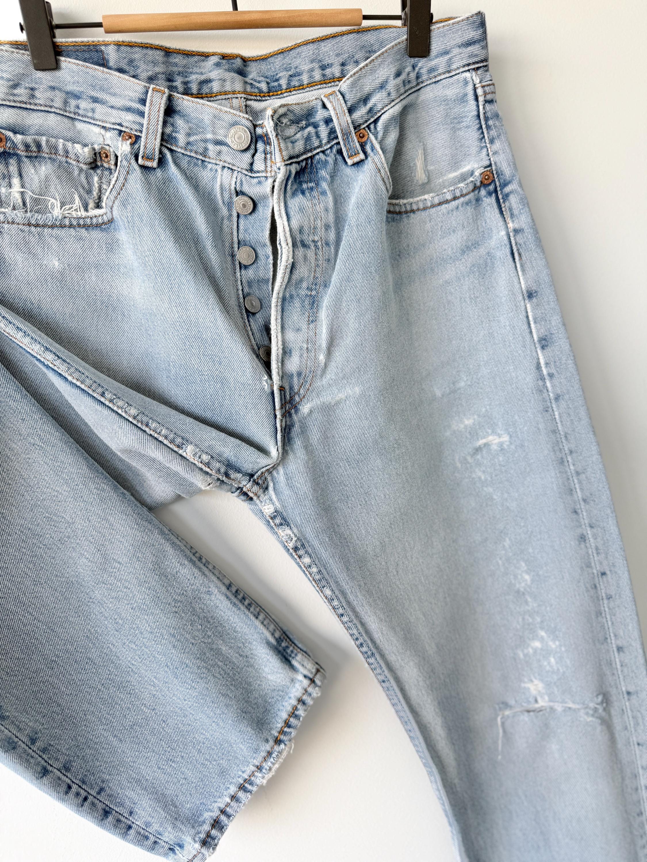 W31 L31 vintage Levis 501 30-31” measured waist light blue very distressed faded denim made in USA 90s