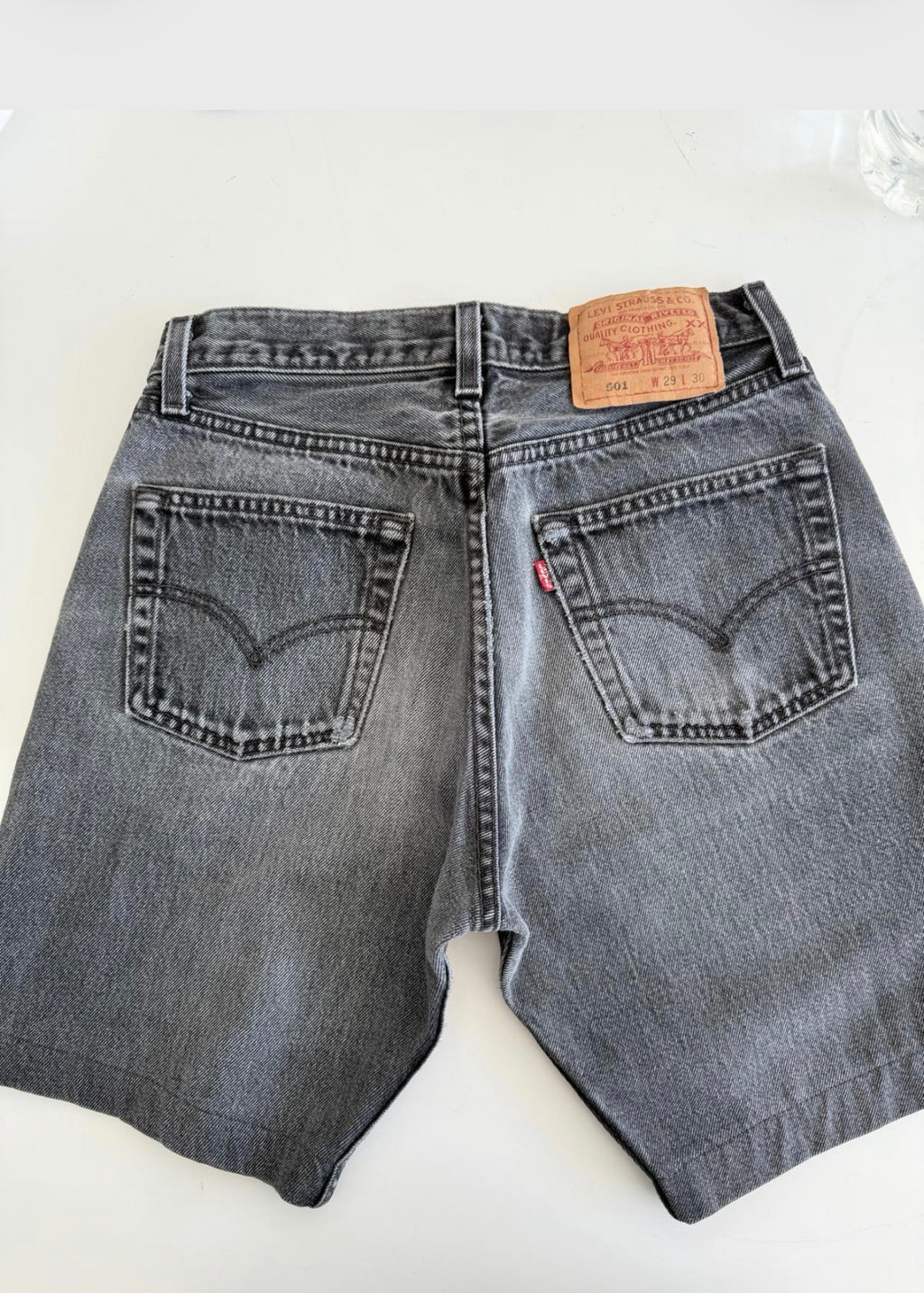 W26 Levis shorts 501 vintage 25-26” waist black faded 501s made in USA for women 90s