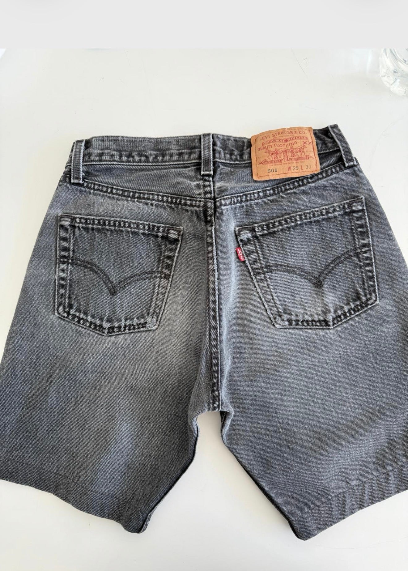 W26 Levis shorts 501 vintage 25-26” waist black faded 501s made in USA for women 90s