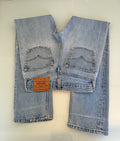 W25 L32 vintage Levis 501 medium light blue 24/25” measured waist 501s USA 90s for women tag