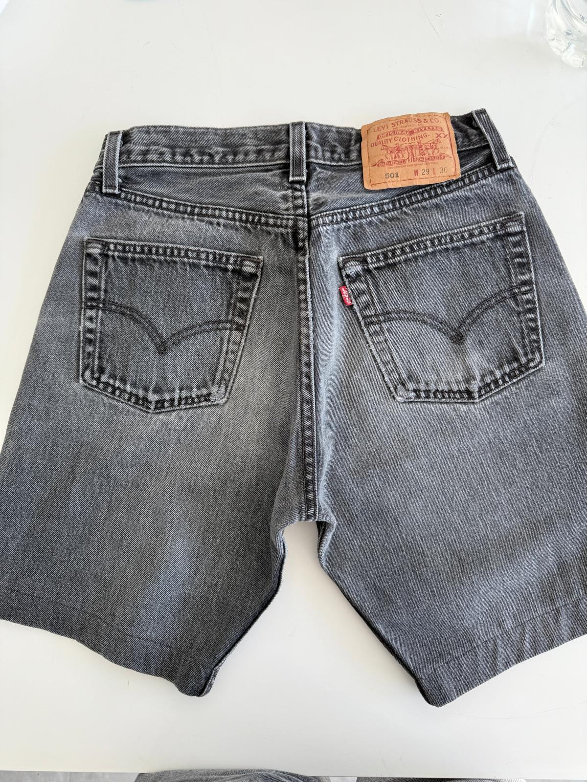 W26 Levis 501 vintage 25-26” waist black faded 501s made in USA for women 90s